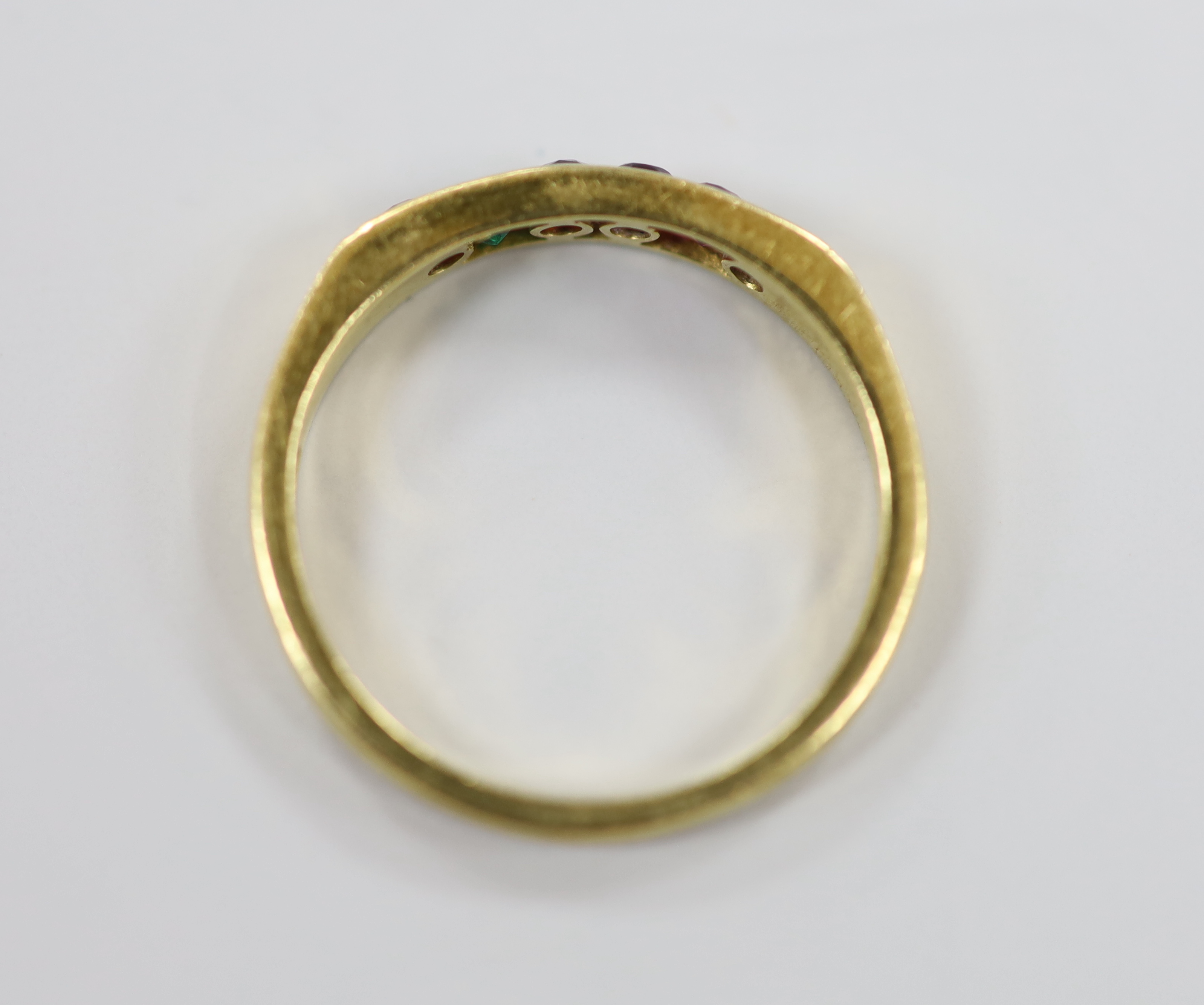 A modern 18ct gold and gem set half hoop 'Regard' ring, size L/M, gross weight 2.7 grams.